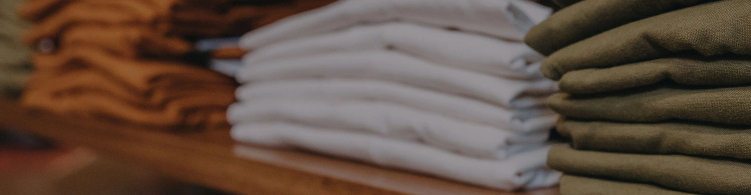 Stacks of folded t-shirts