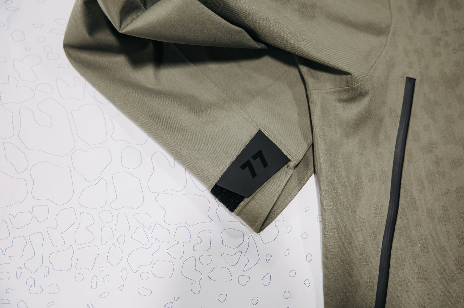 Mine 77 Jacket laid over drawing of fabric print