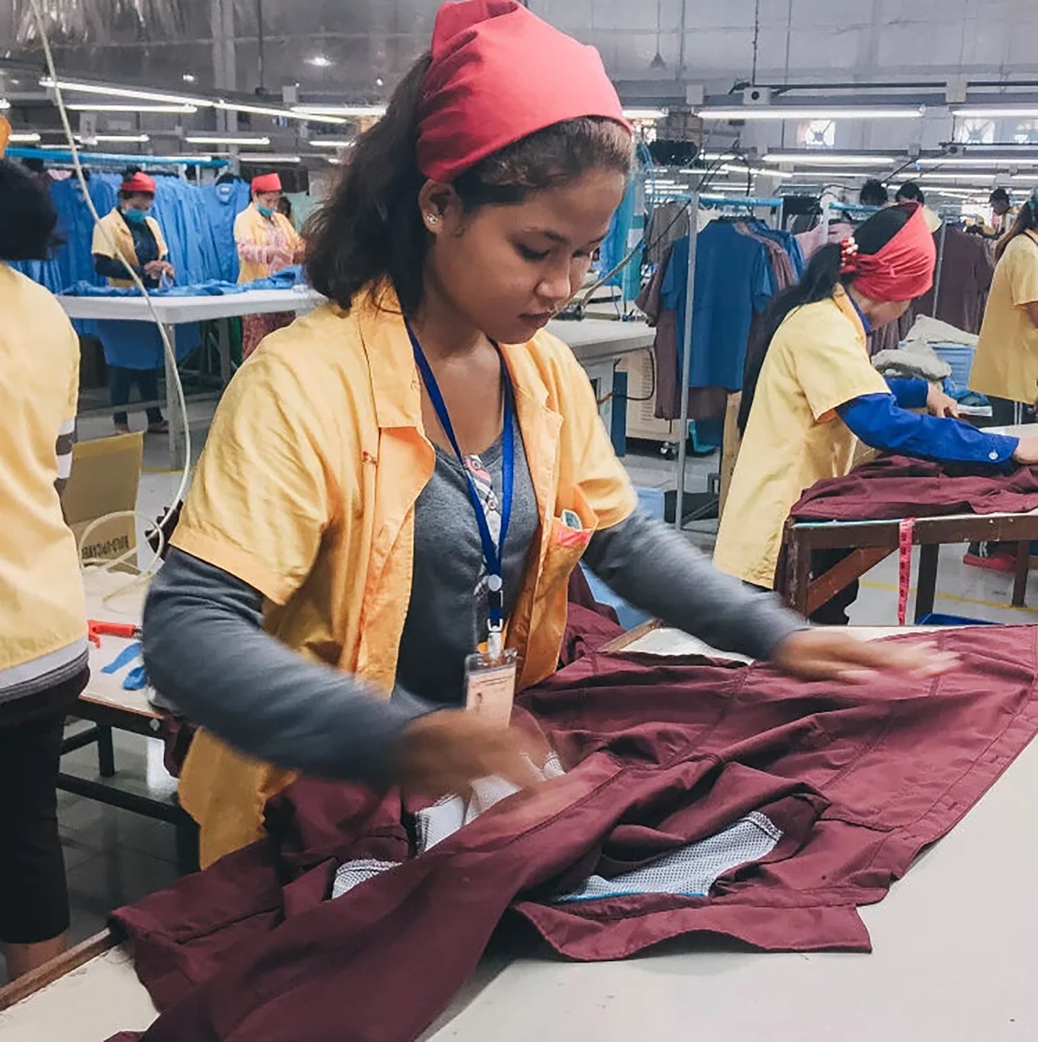 Factory workers inspecting garments