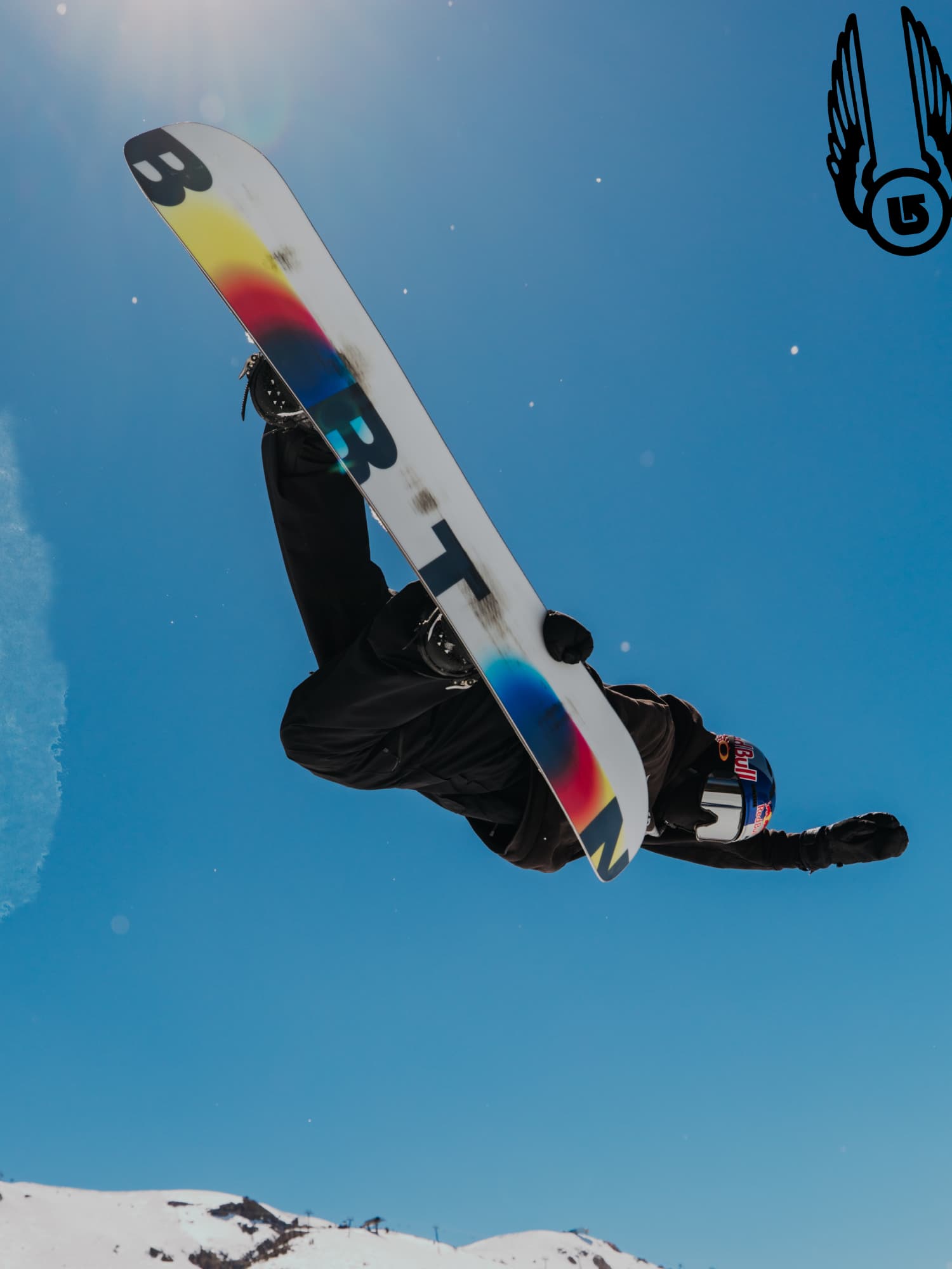 Snowboarder performing an aerial trick with Burton snowboard – Proven performance