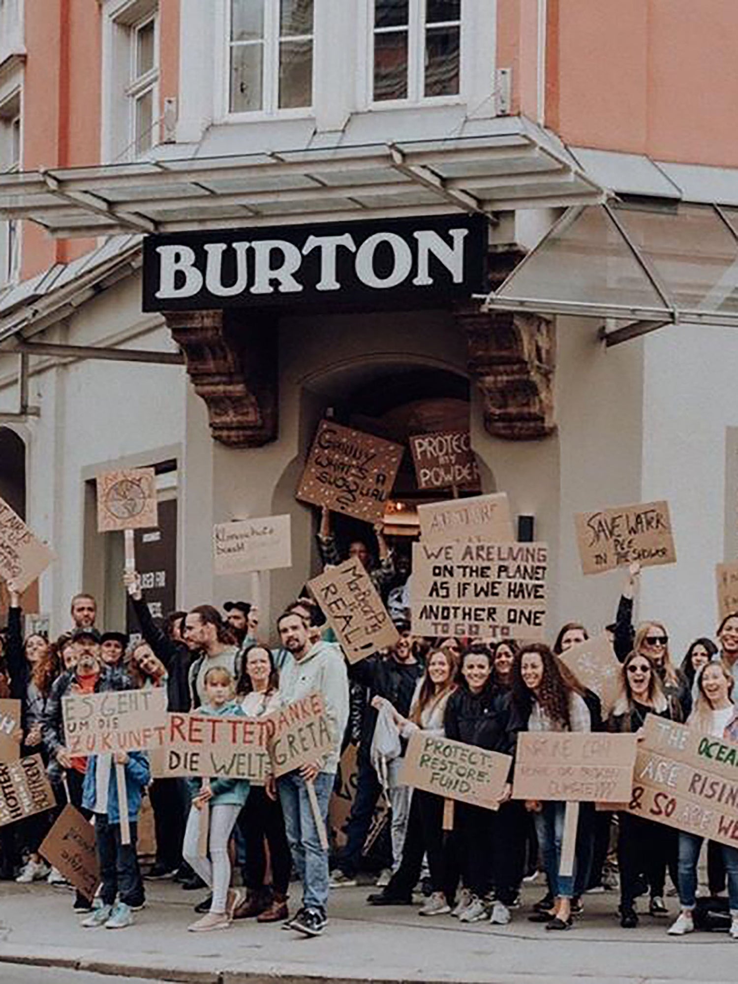 Group of Burton employees participating in a climate protest in front of the Burton Store