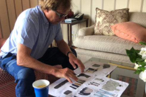 Jake Burton Carpenter looks over Mine 77 product line photos