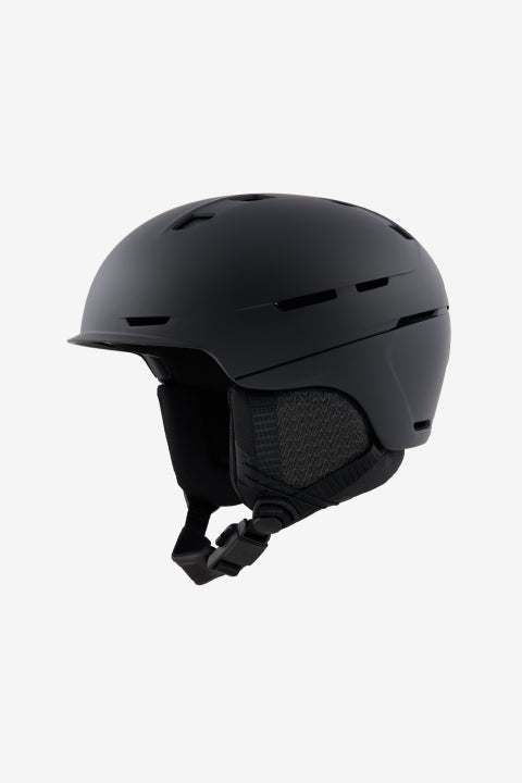 A matte black ski helmet with integrated ventilation slots and a chin strap, shown from a side profile on a light gray background.