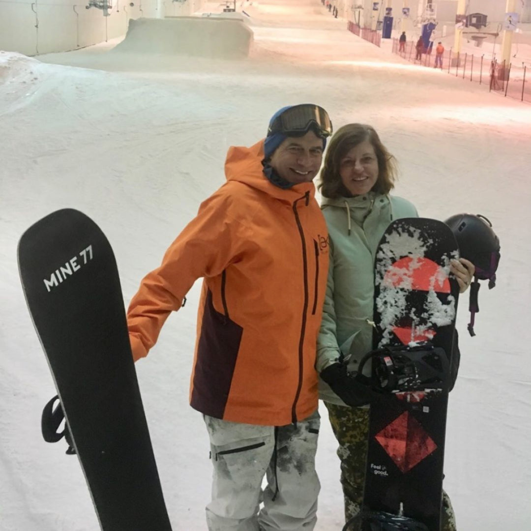 Jake and Donna Carpenter snowboarding together