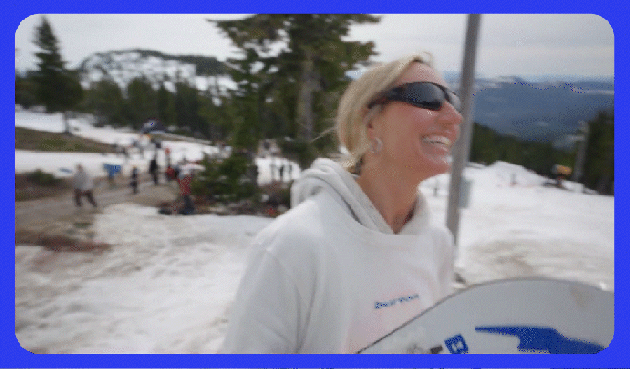 Maria Thomsen holding her snowboard from the 2nd of 4 videos in the series.