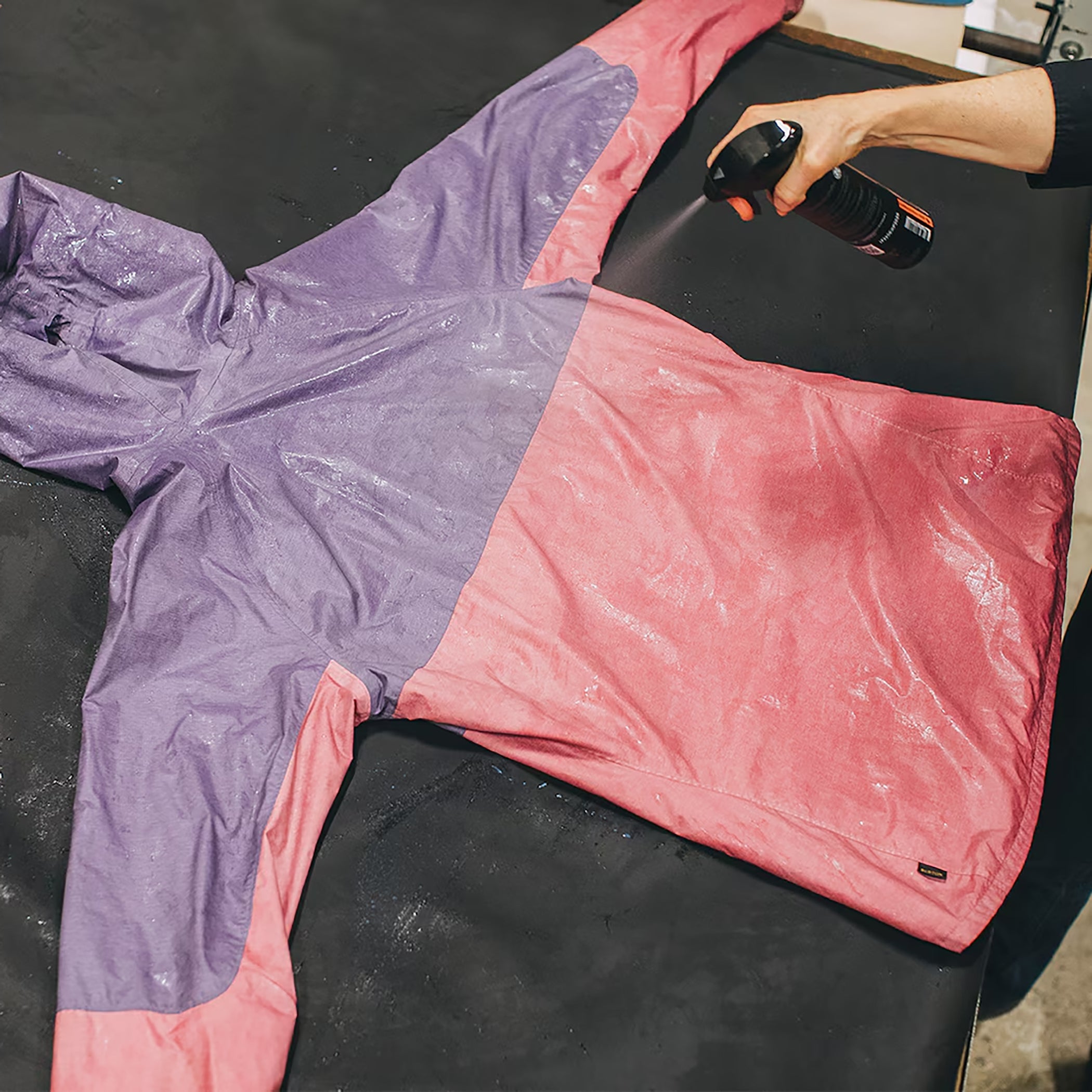 waterproof coating gets applied to a rain jacket